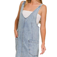 Light wash denim overall dress with side pocket and adjustable shoulder straps