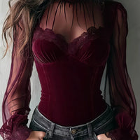 Burgundy velvet corset-style blouse with sheer sleeves and lace trim neckline and cuffs