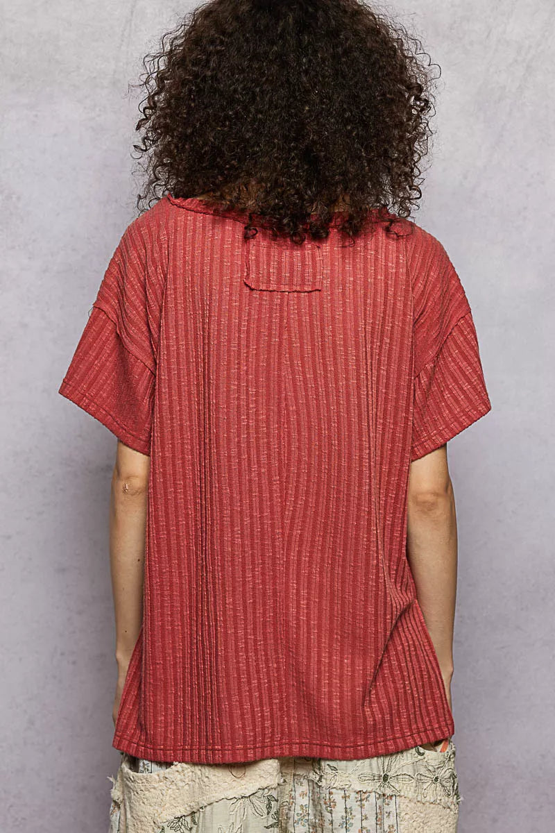 Terra cotta ribbed knit V-neck t-shirt back view with side slit