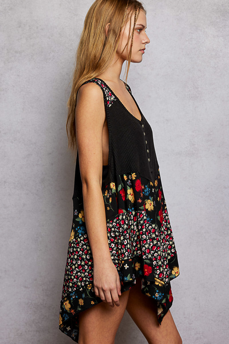 Black ribbed tank top with floral woven patch panels and asymmetrical hem