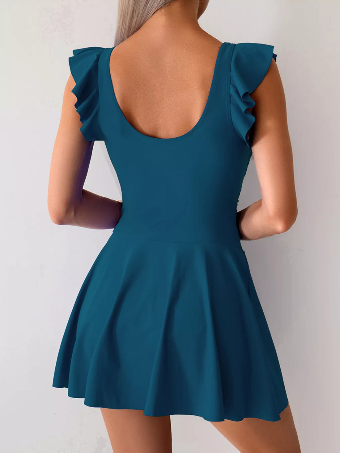 Peacock blue ruffled-sleeve swim dress with scoop back and gathered skirt