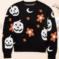 Black long-sleeve crewneck sweater with jack-o-lantern, flowers, bats, stars, and moons print