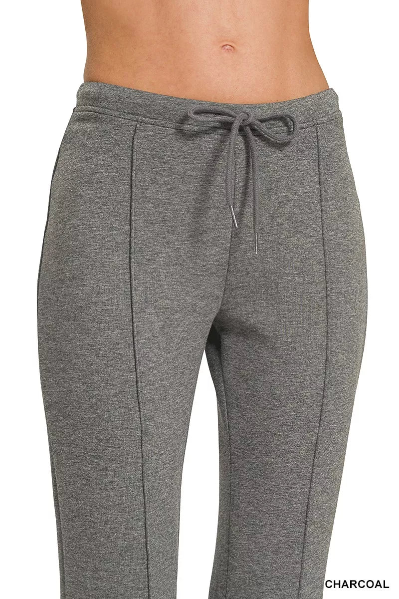 Charcoal drawstring waist pants with front pintuck seams and straight-leg silhouette