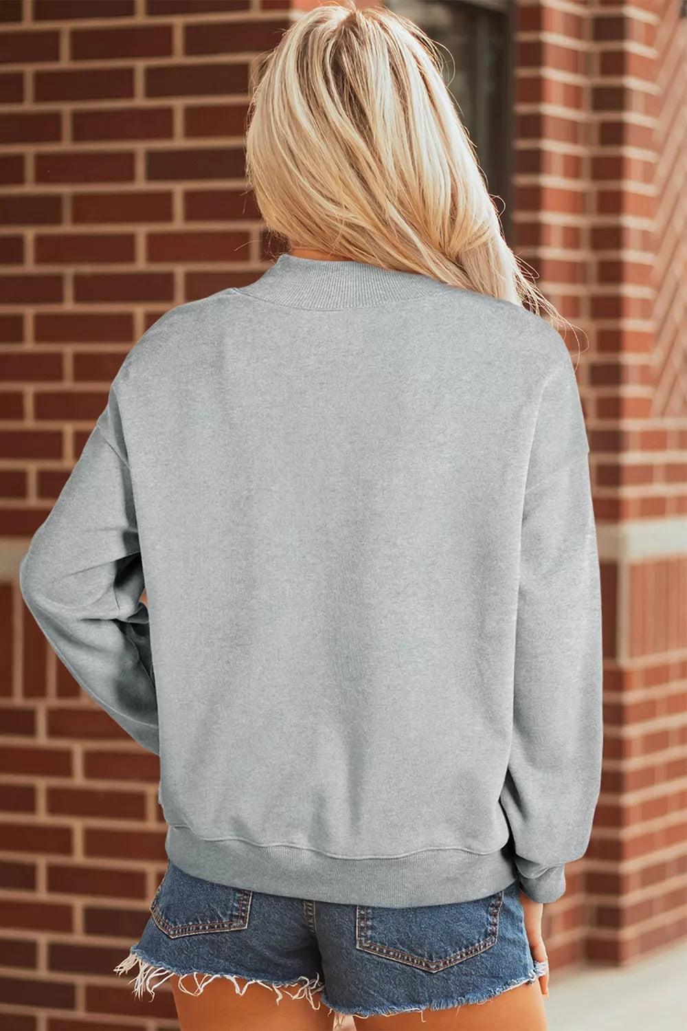 Gray mock-neck pullover sweatshirt back view with relaxed long sleeves
