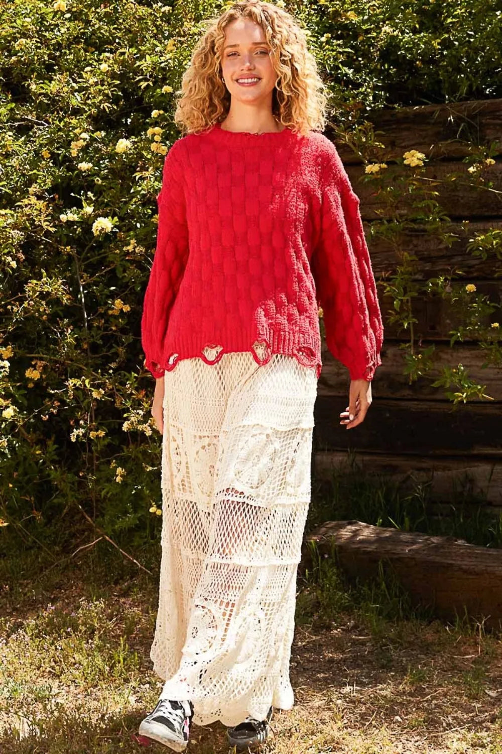 Red checkered distressed edge sweater with scalloped hem and long sleeves
