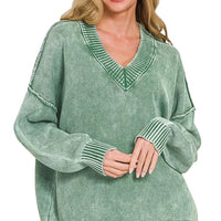 Dark green washed oversized V-neck sweater with ribbed neckline, cuffs, and hem
