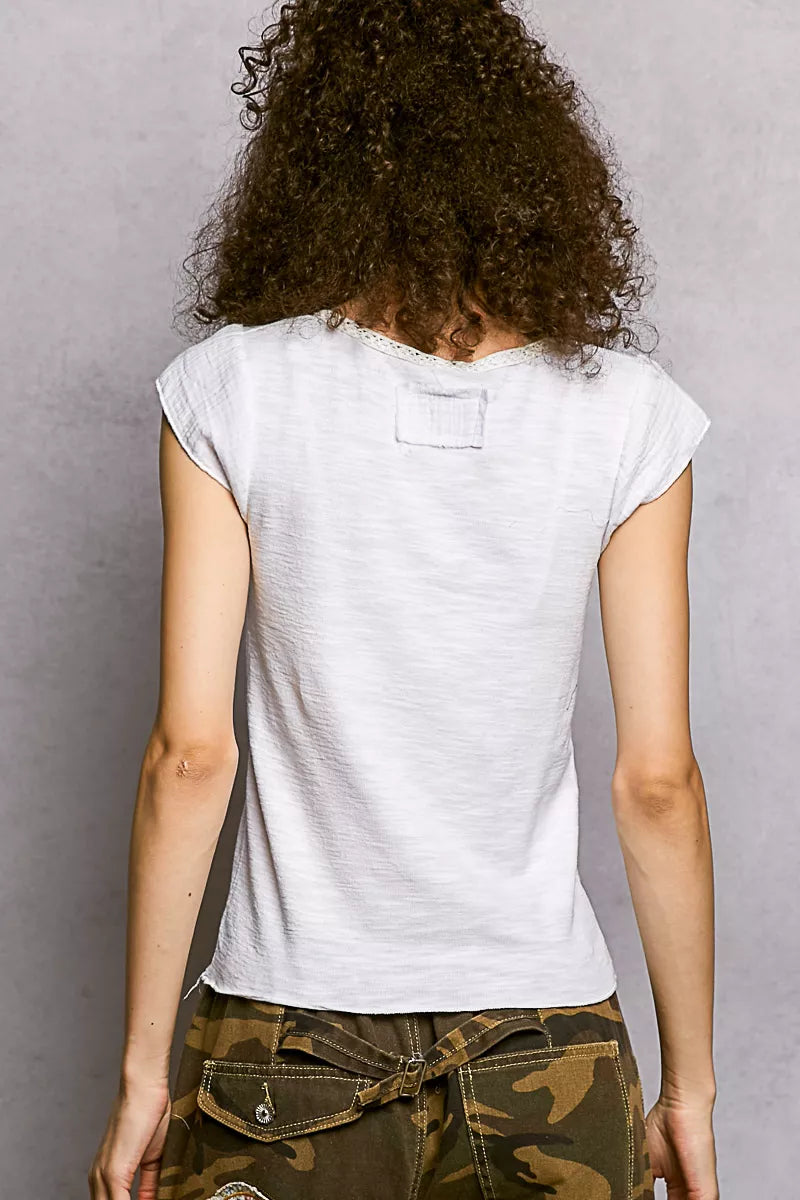 Off-white textured knit top, back view, short sleeves and scoop yoke seam