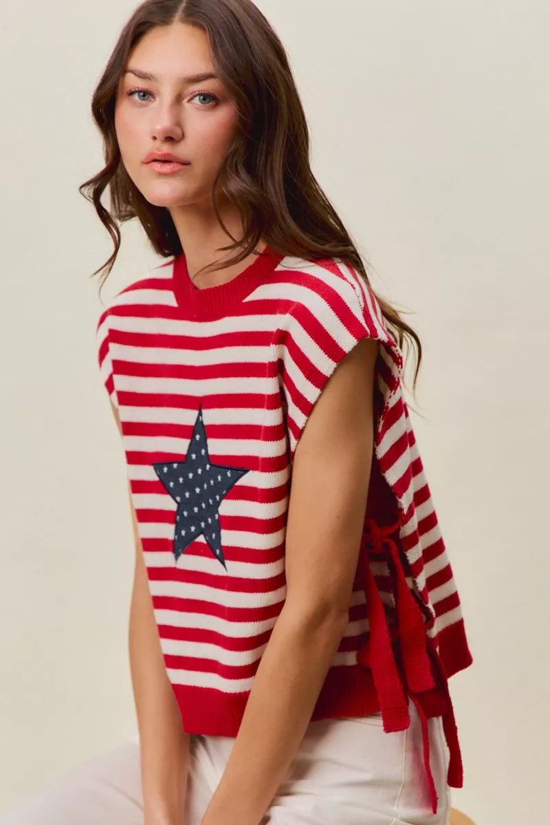Red and ivory striped sleeveless vest top with navy star patch and tied side sleeves