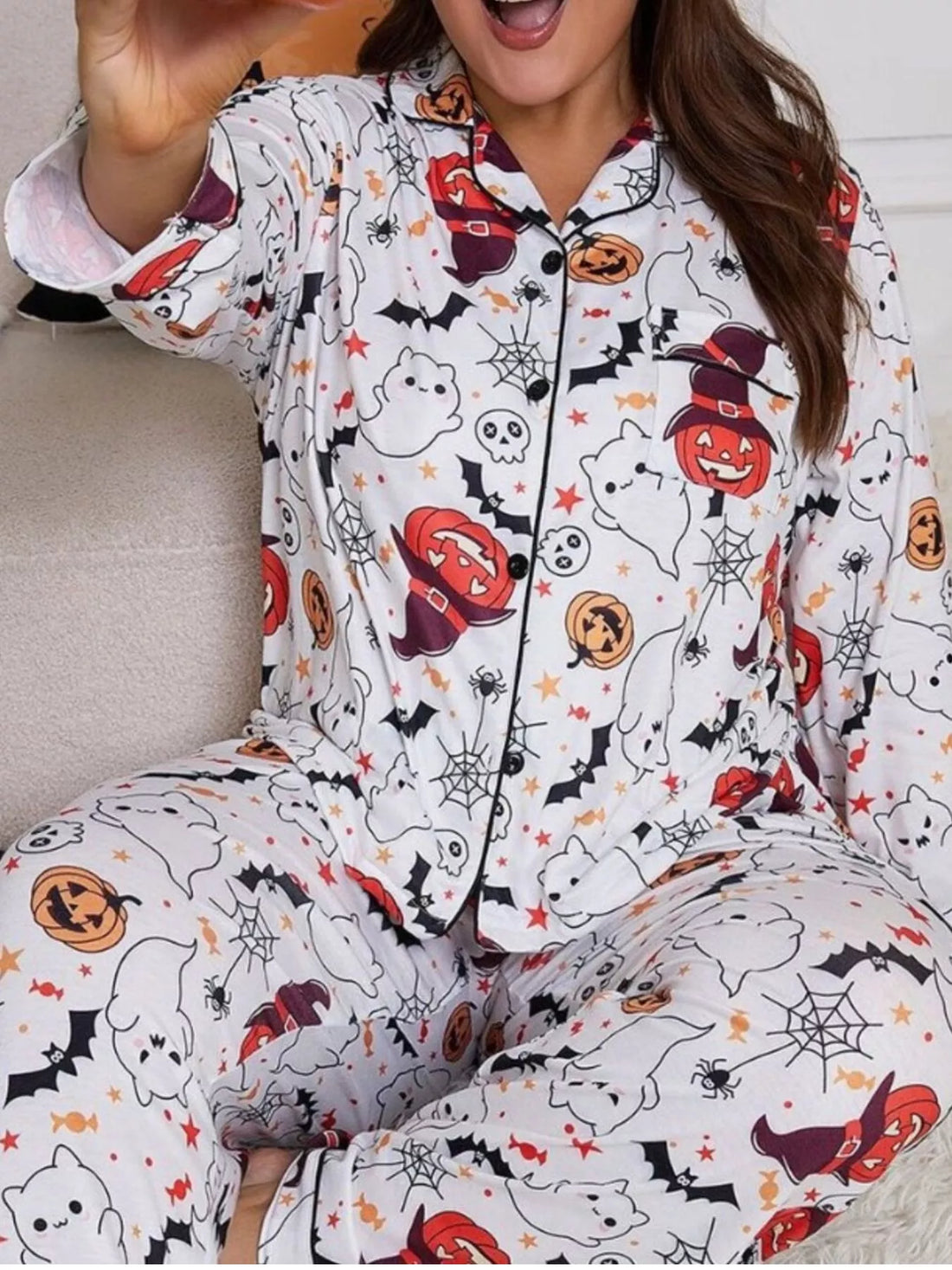 Plus size pajama set with white collared, button-front top and Halloween print pants