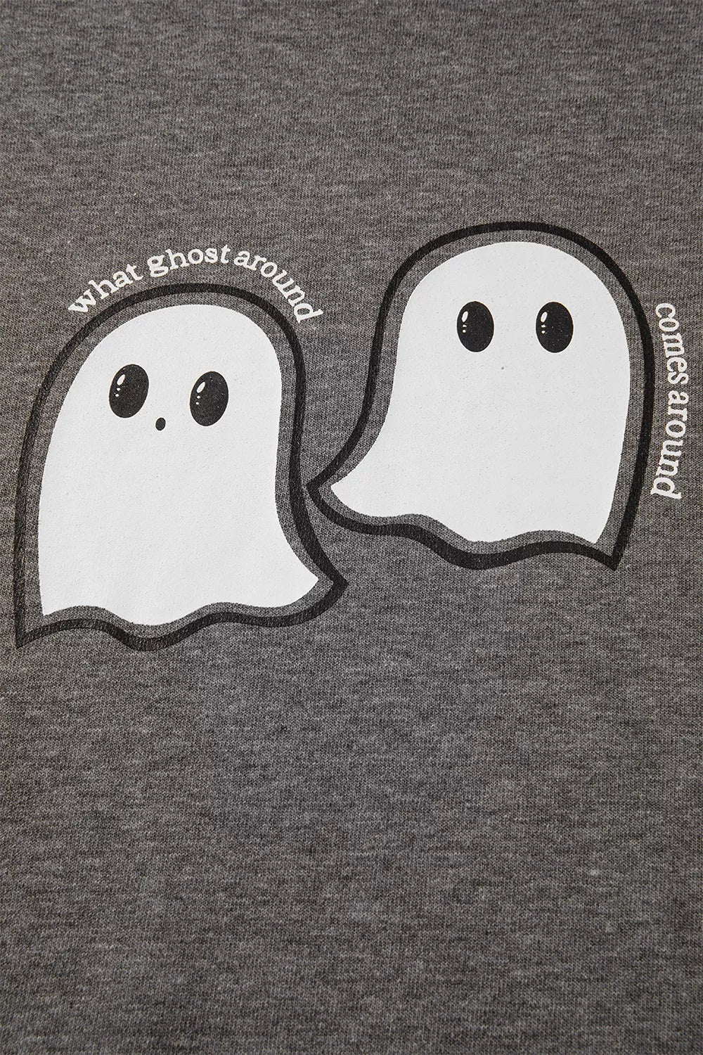 Close-up of dark gray hoodie fabric with ghost face print and curved text