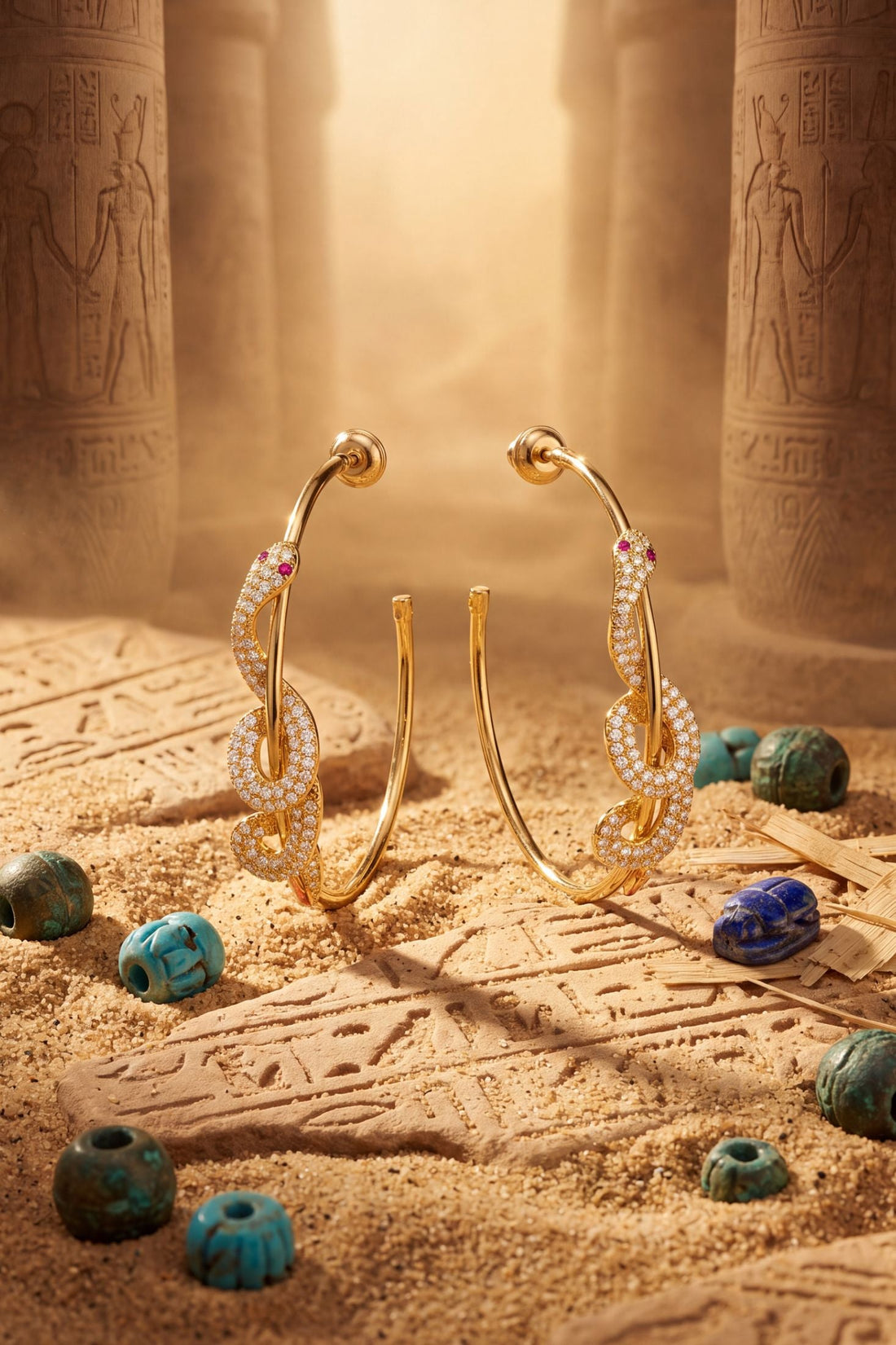 Gold snake hoop earrings with colorful stone accents and sparkling details