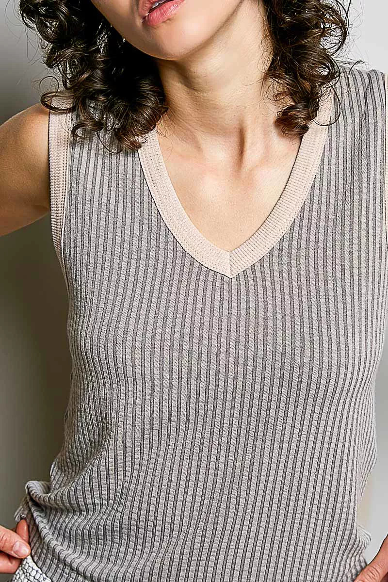 Light grey ribbed V-neck sleeveless tank with contrast trim, neckline close-up.