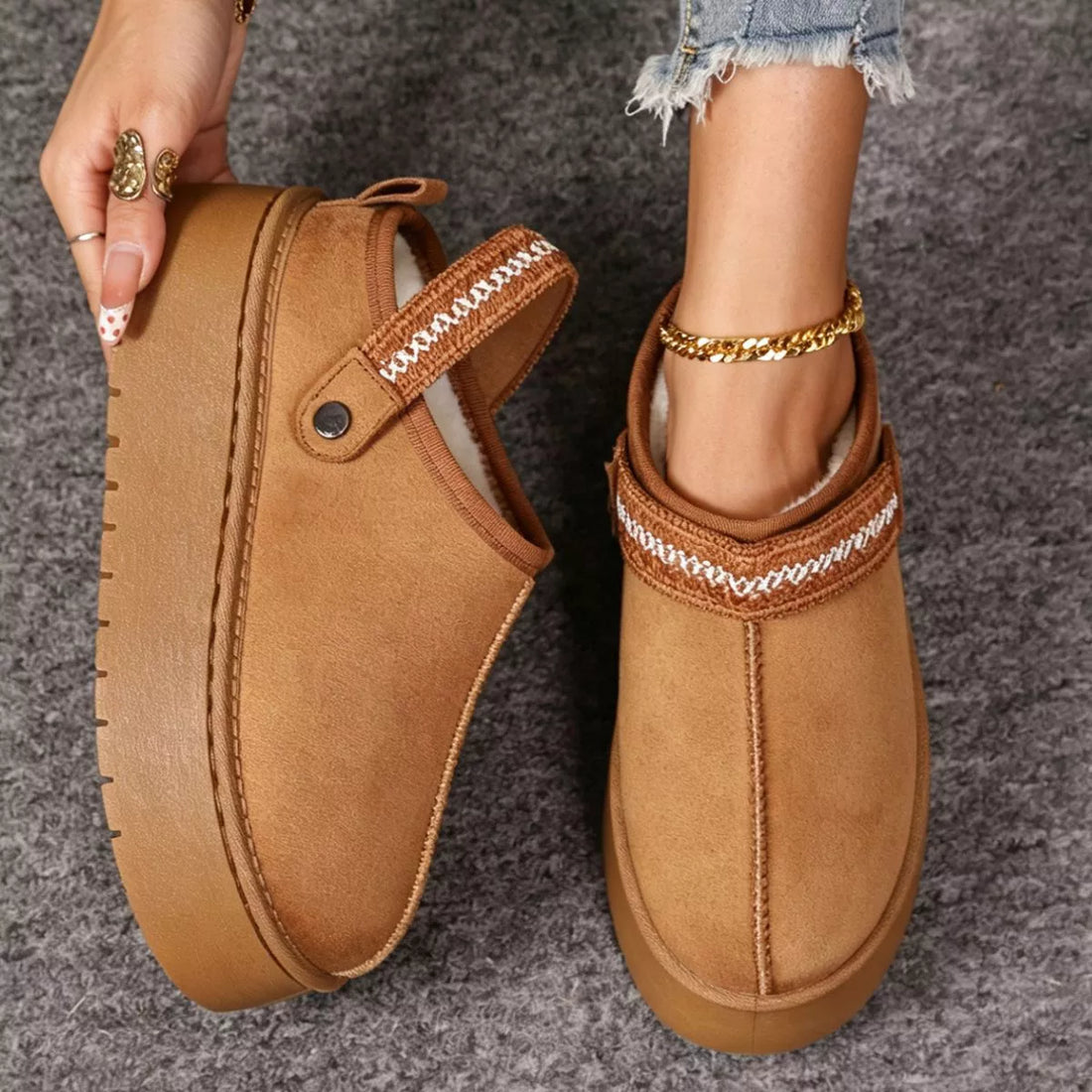 Camel suede fur-lined platform boots with decorative stitching and side button strap.