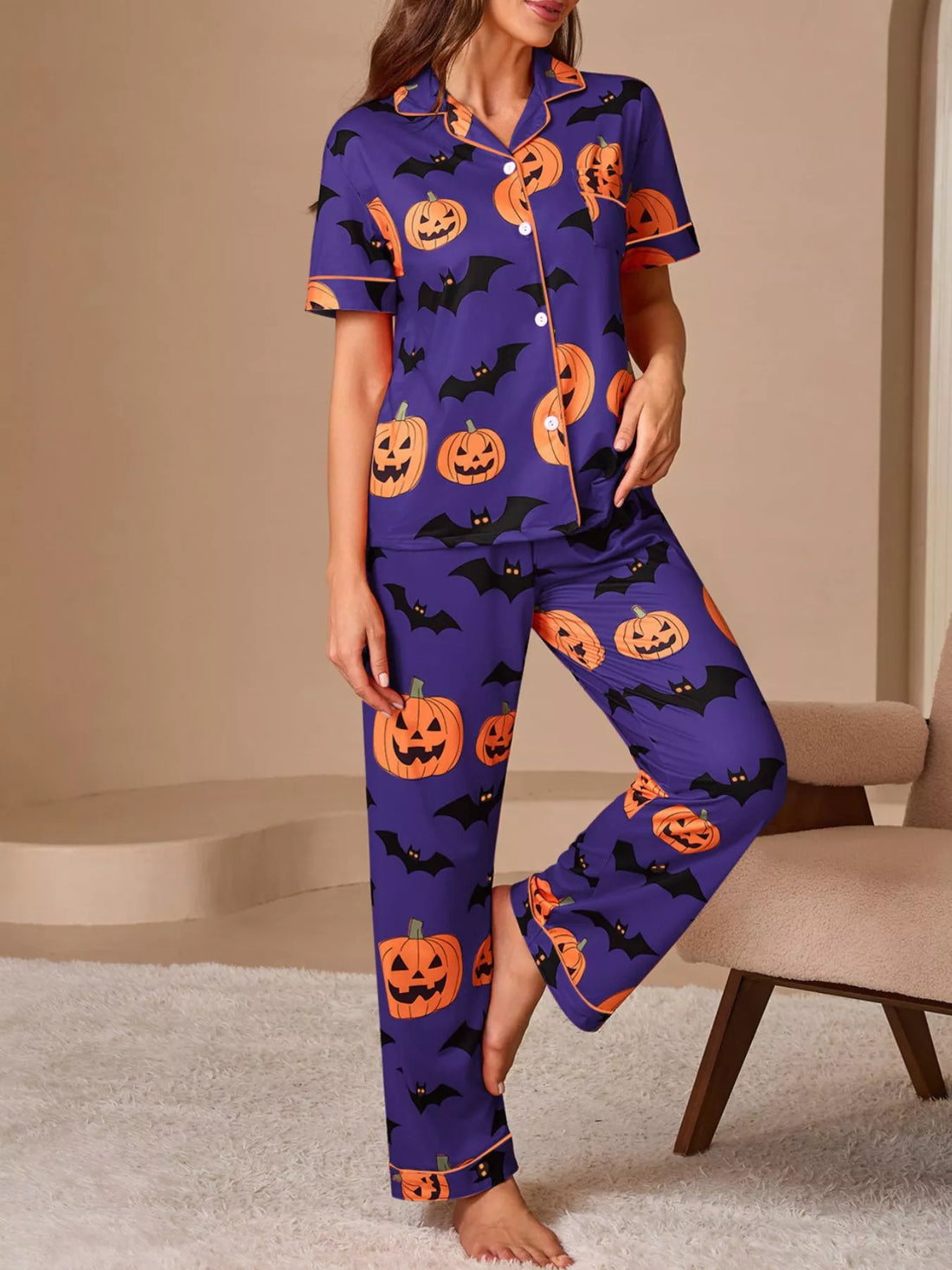 Halloween pajama set: purple short-sleeve button top and straight-leg pants with orange pumpkin bat print