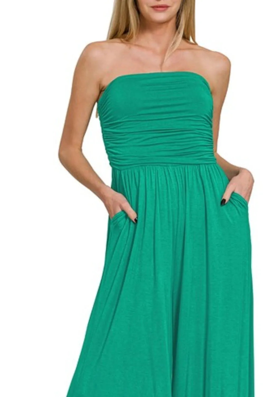 Green strapless tube jumpsuit with ruched bodice and gathered tiered skirt