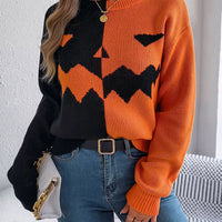 Two-tone pumpkin face graphic sweater, orange/black zip-front knit, long sleeves