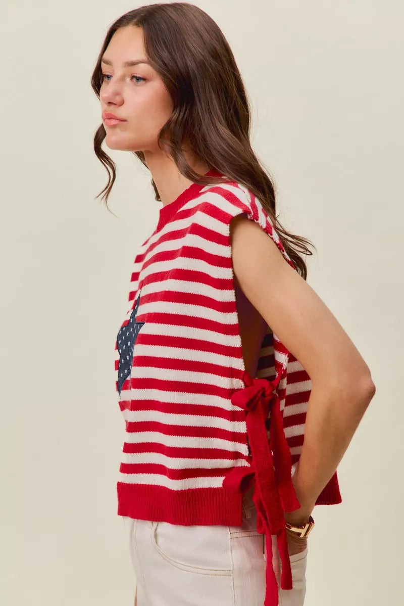 Red and ivory striped sleeveless vest top with navy star patch and tied side detail
