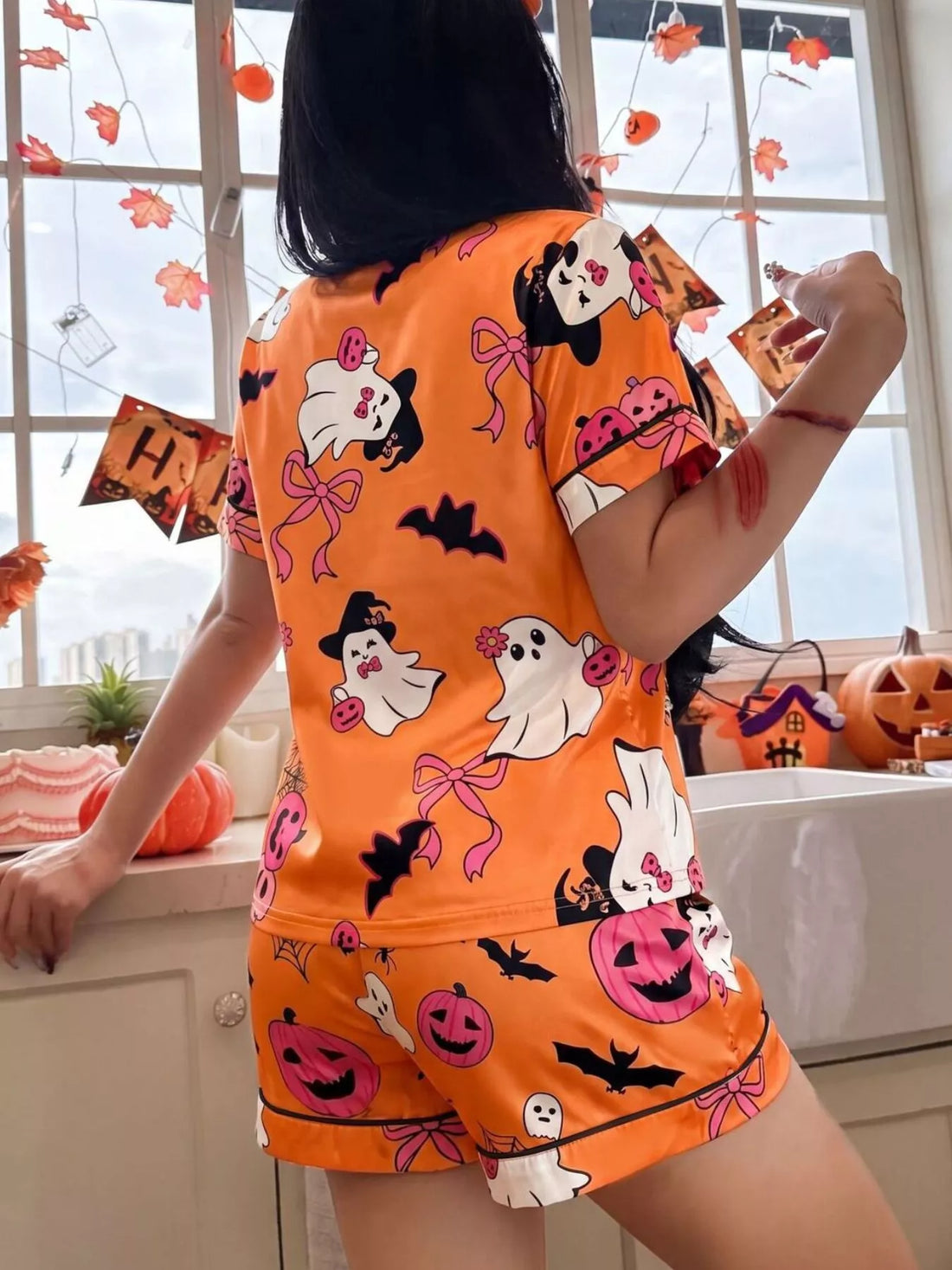 Orange Halloween button-down top and matching shorts, allover ghost and bat pattern