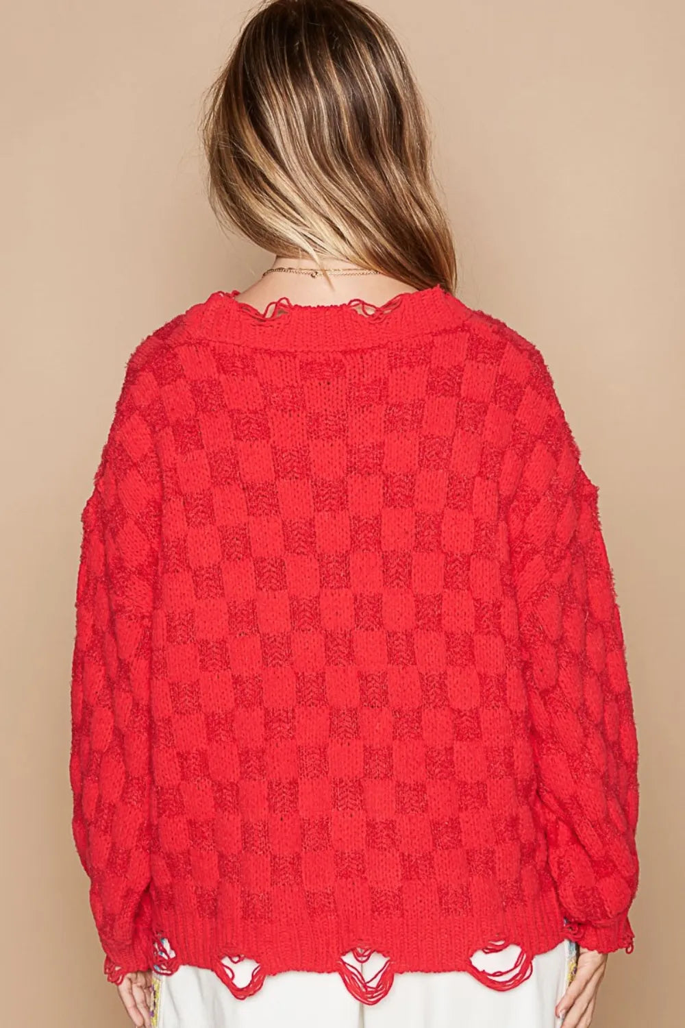 Red checkered sweater with scalloped distressed hem, back view