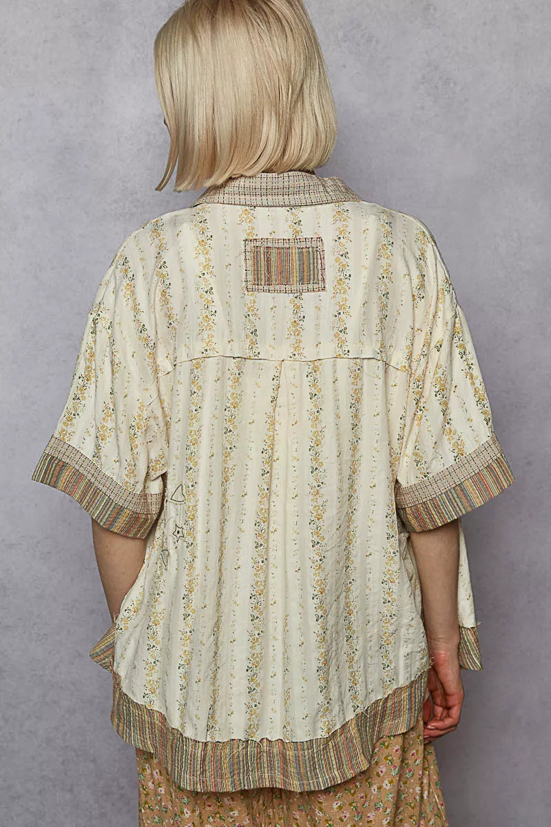 Cream patchwork short-sleeve button-down shirt back with striped yoke and scalloped hem