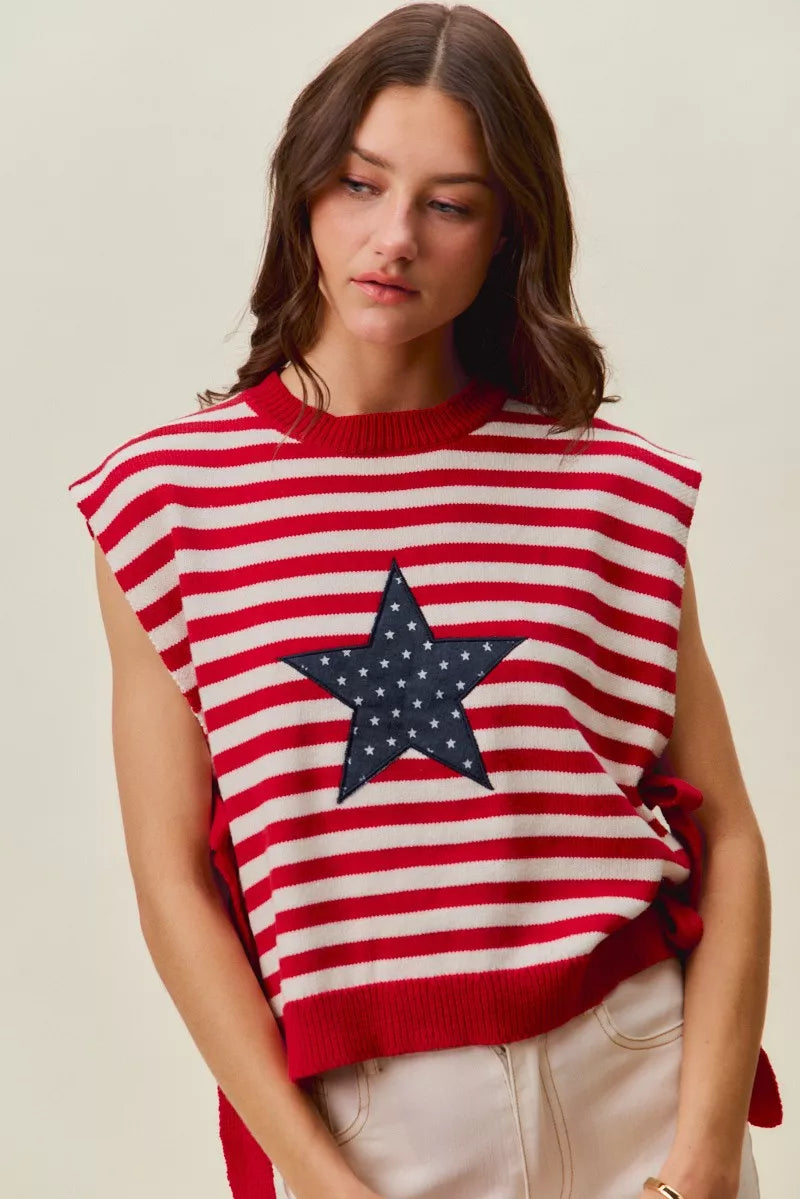 Red and ivory striped sleeveless vest top with navy star patch and side ties