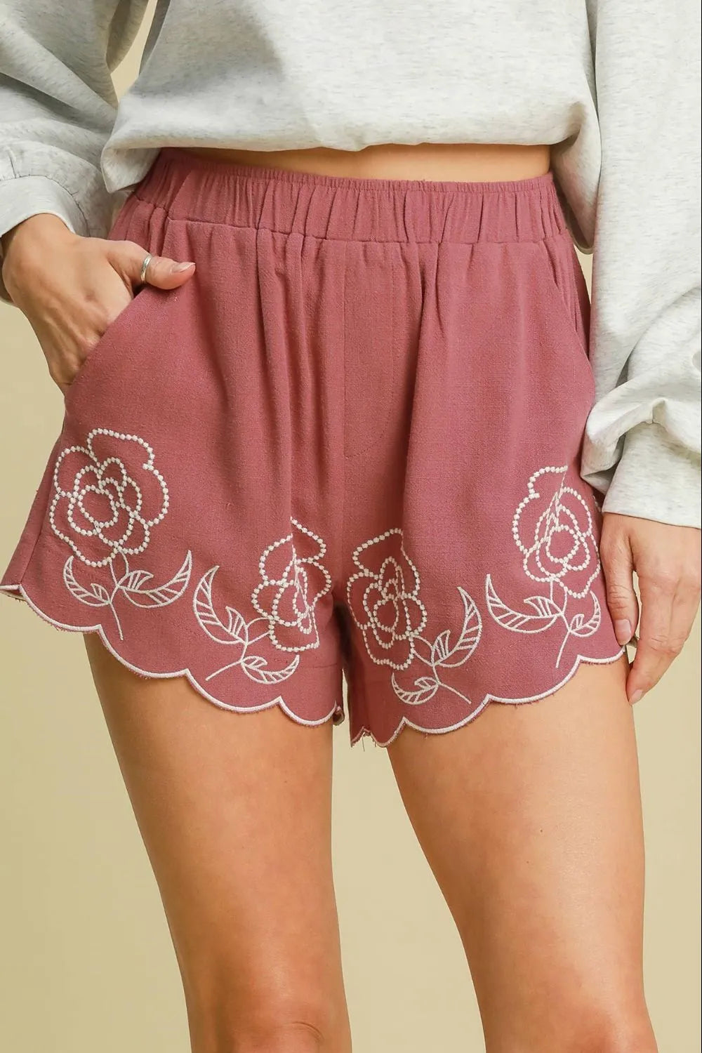 Dusty pink embroidered linen-blend shorts with elastic waistband and scalloped hem