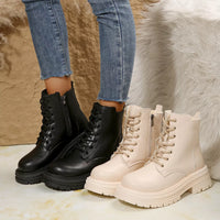 Black and off-white lace-up platform round-toe boots with side zips