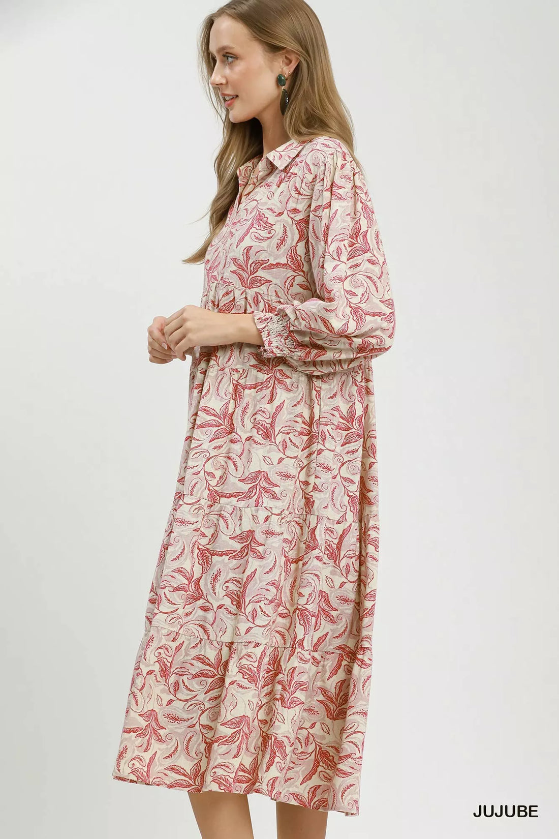 Tiered midi dress with pink botanical print, long sleeves, shown in side profile