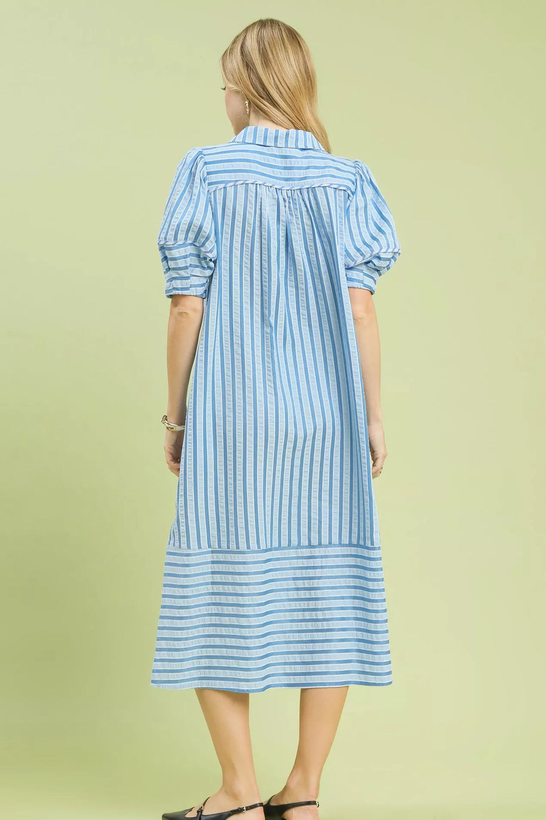 Blue-and-white striped midi dress, back view with gathered puff sleeves.