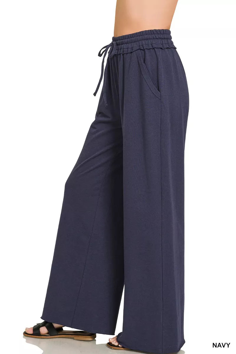 Navy wide-leg sweatpants with adjustable drawstring waist, side view