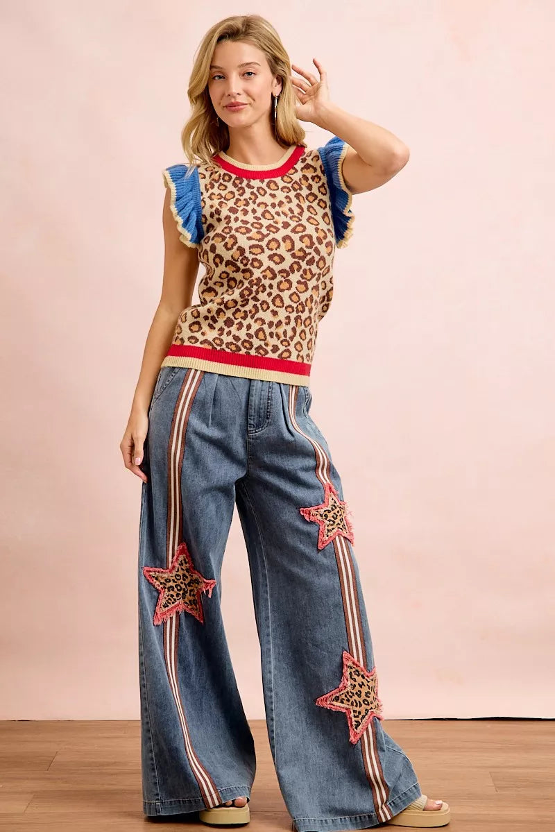 Leopard print knit tank top, blue ruffled sleeves, red collar and hem band