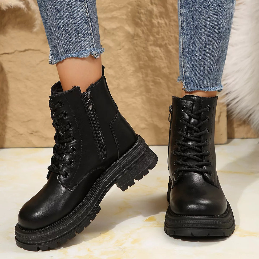 Black lace-up platform round-toe boots with side zip and layered tread sole