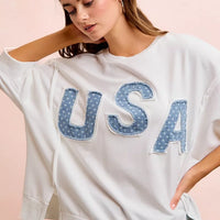 Ivory french terry top with appliqued blue "USA" letters, loose fit and short sleeves