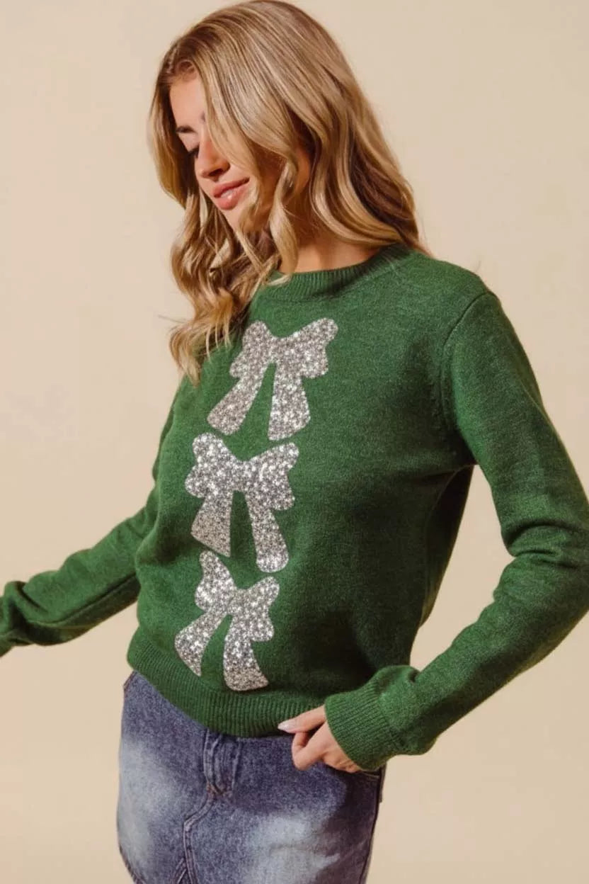 Hunter-green Christmas sweater with silver sequin bow ribbon detail at back