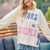Cream sweatshirt with STAR-themed patch prints, red stripes, and blue stars