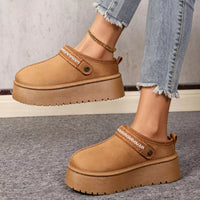 Camel suede fur-lined platform boots with button strap, patterned trim, and thick sole.