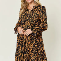 Caramel and black printed long-sleeve V-neck dress with gathered skirt