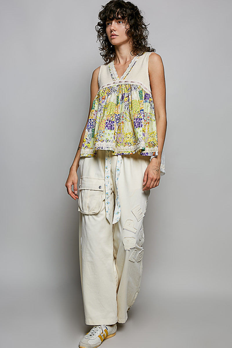 Sheer V-neck lace-trim tank with colorful floral pattern and longer length