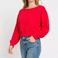 Ruby red cropped pullover sweatshirt with boat neck and relaxed long sleeves