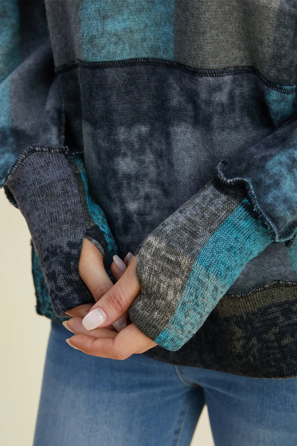 Dark gray plaid fleece hoodie with dropped shoulders and contrast knit cuffs