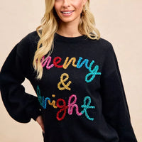 Black crewneck sweater with multicolor tinsel "Merry & bright" lettering, long sleeves.