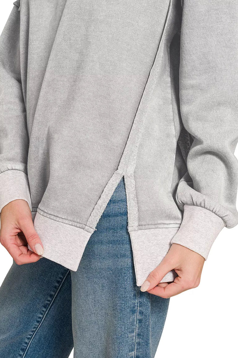 Gray fleece pullover with contrast side seam and banded hem; long sleeves