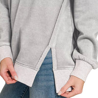 Gray fleece pullover with contrast side seam and banded hem; long sleeves