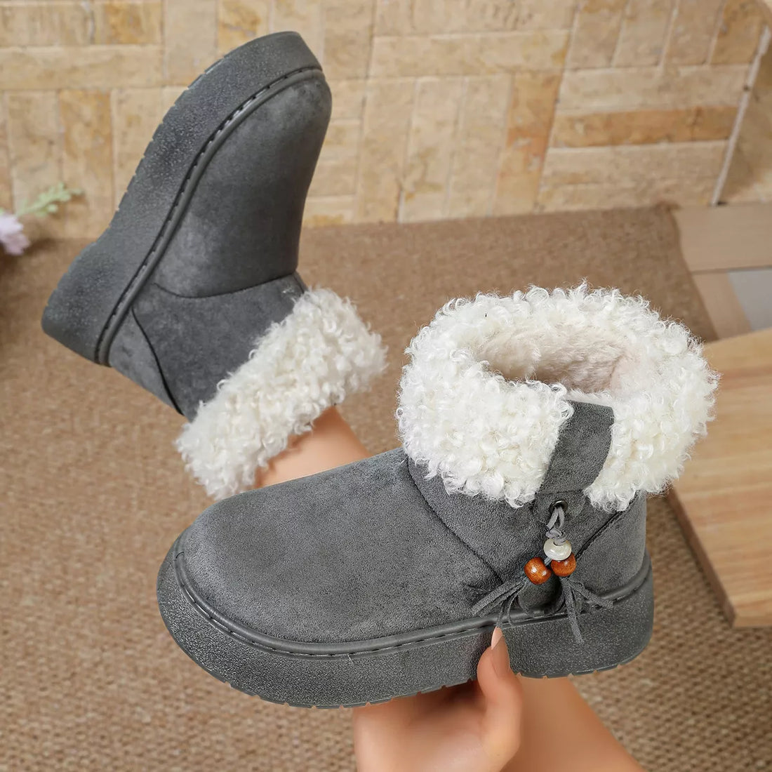 Gray suede boots with round toe, faux fur cuffs, lace tassel and bead detail