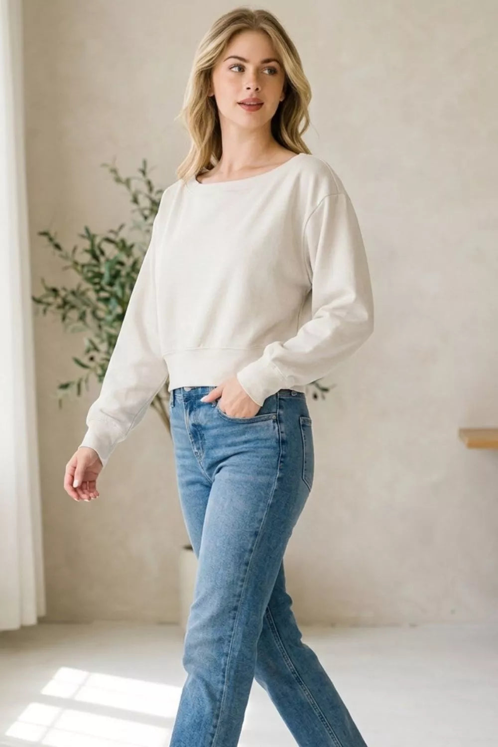 Bone cropped boat-neck pullover sweatshirt with long sleeves, casual everyday wear