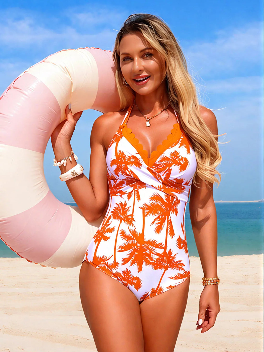 Orange-and-white tropical palm print halter one-piece swimsuit with V-neck