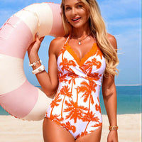 Orange-and-white tropical palm print halter one-piece swimsuit with V-neck