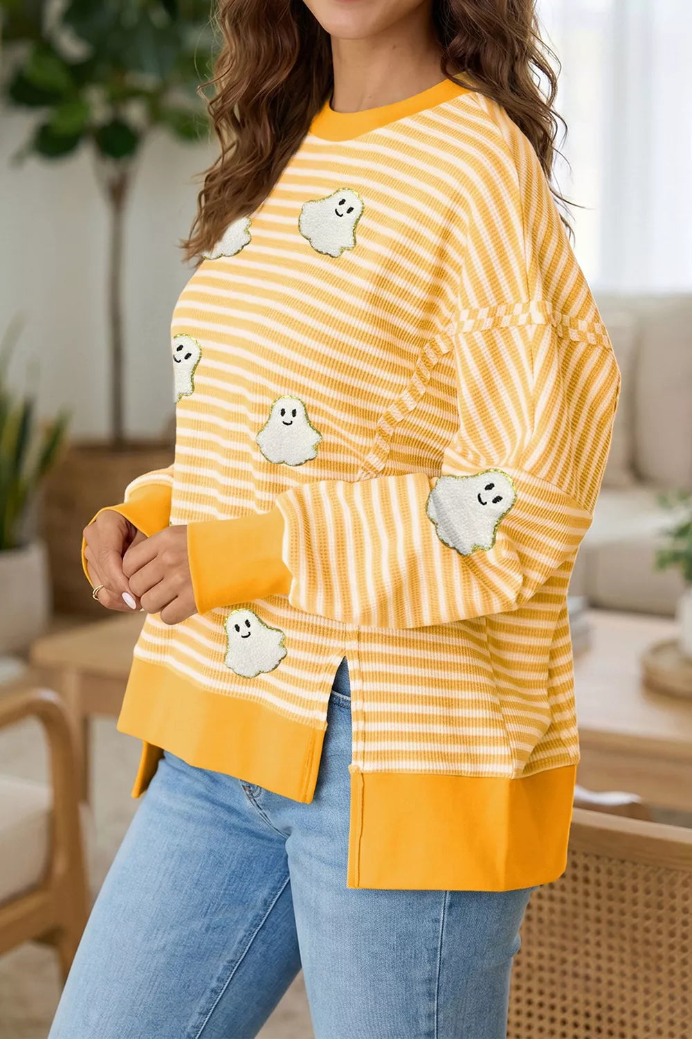 Yellow and white striped long-sleeve top with ghost patches and yellow hem
