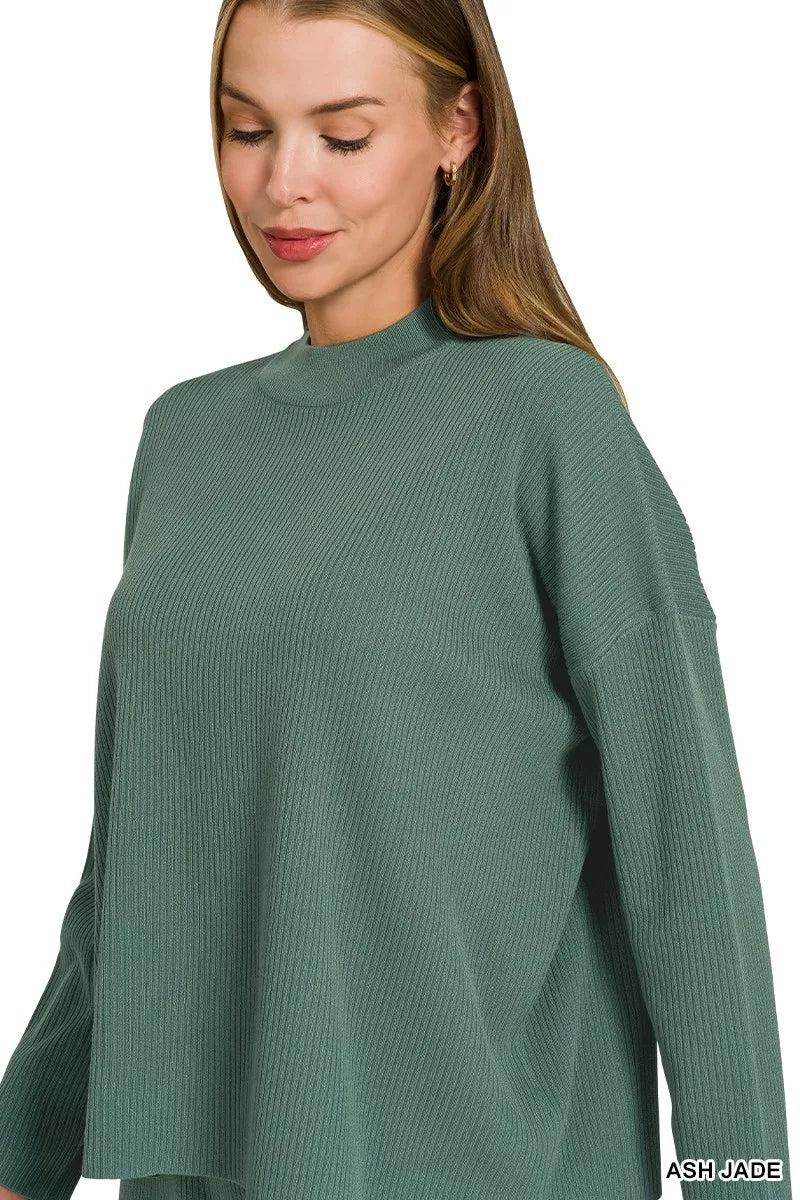 Teal-green crew-neck sweater top with long sleeves and textured knit