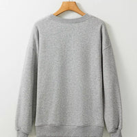Gray sweatshirt on hanger, plain back with long sleeves and round neckline
